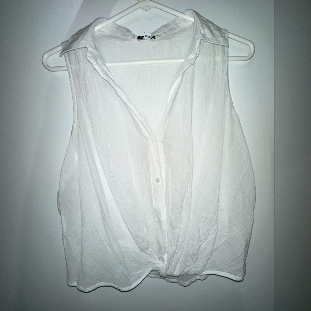 White linen sleeveless button down top